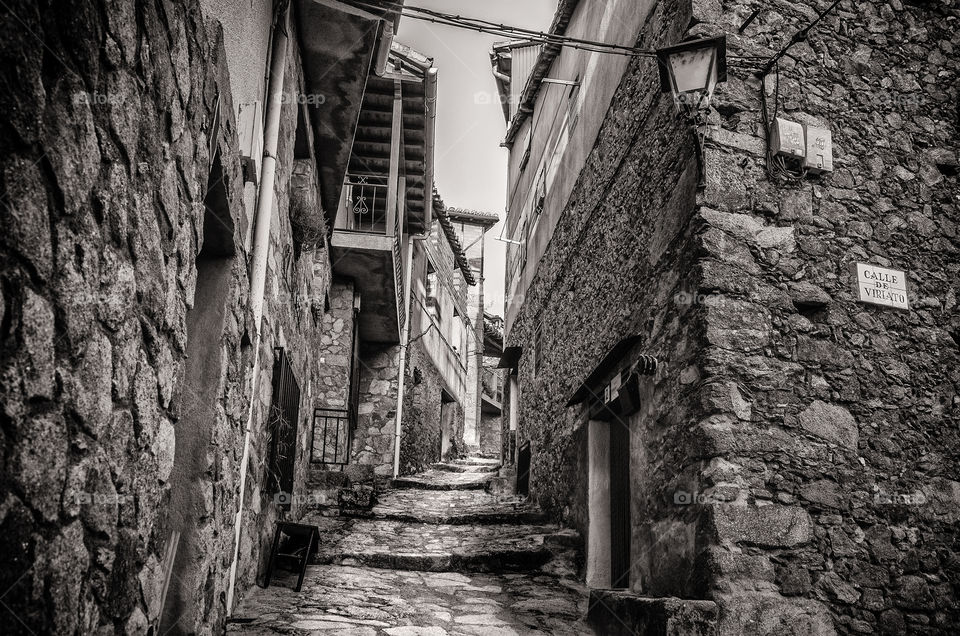 Stone alley in an old town in Spain