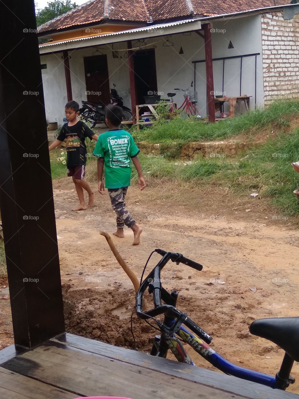 The village boy is happy to play happily