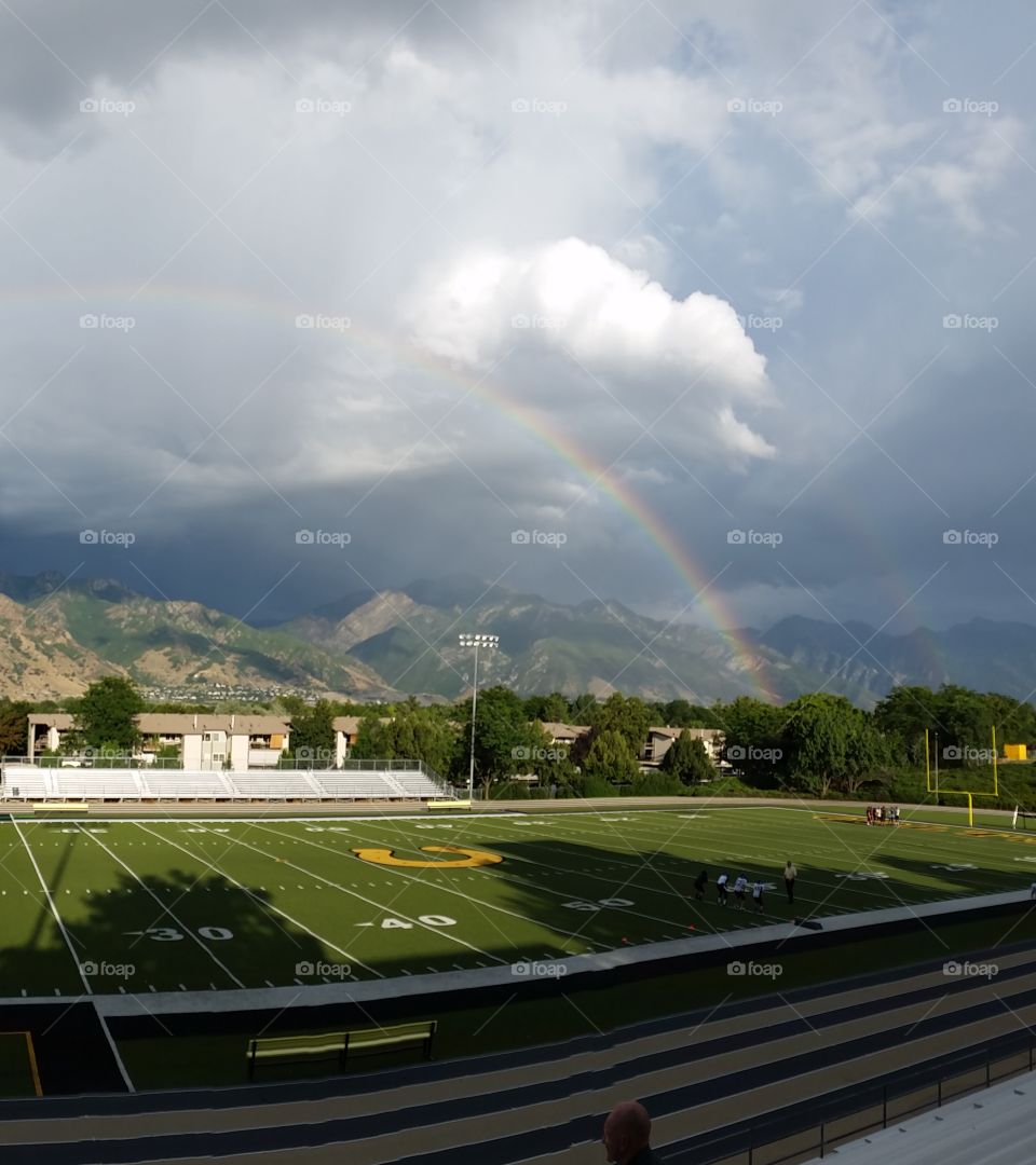 rainbow over football field