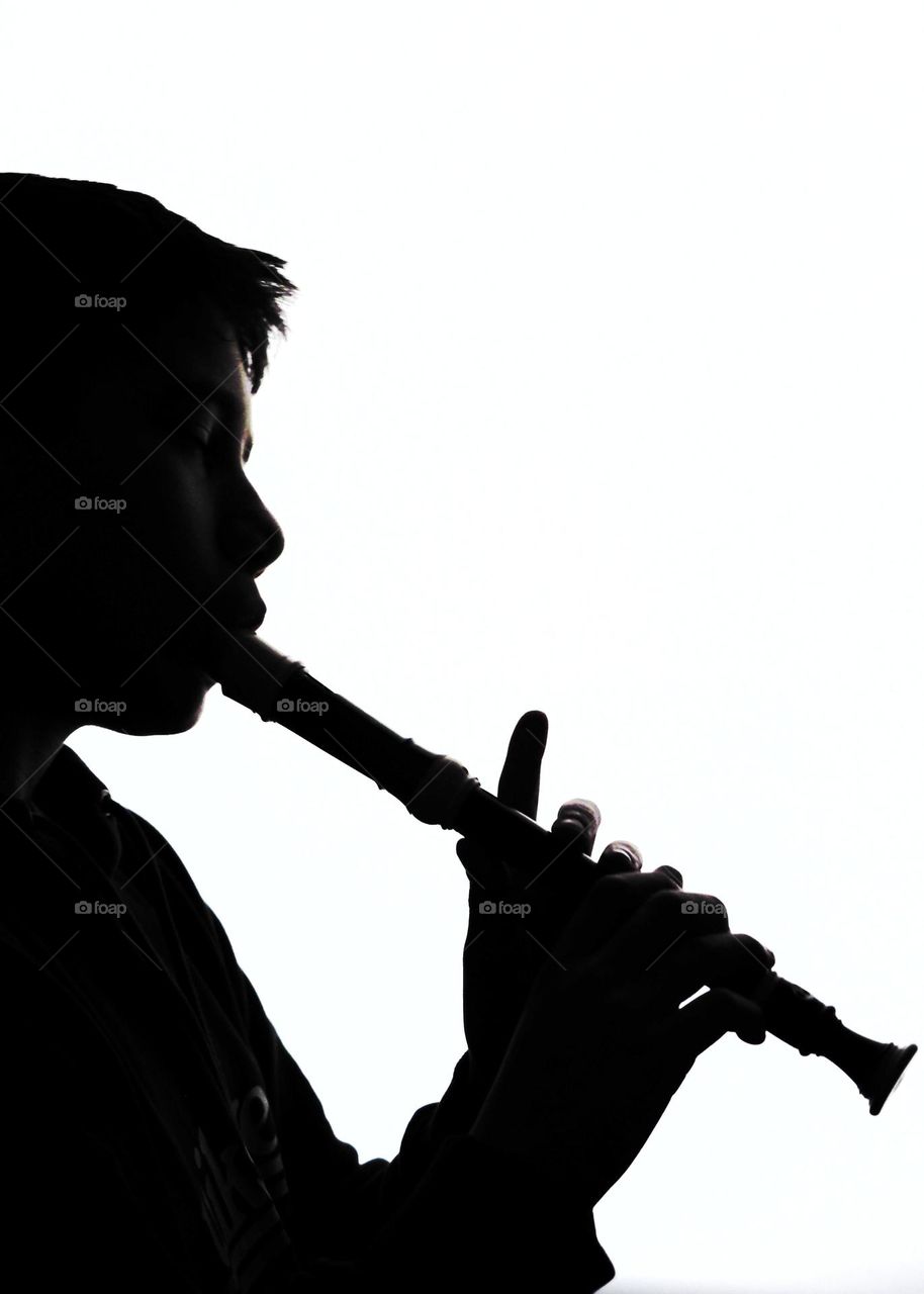Flute playing silhouette