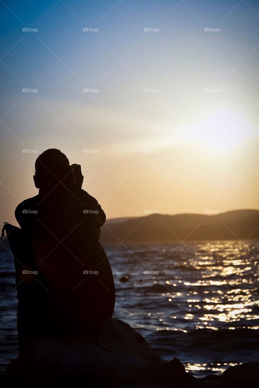 Woman at beach during sunset