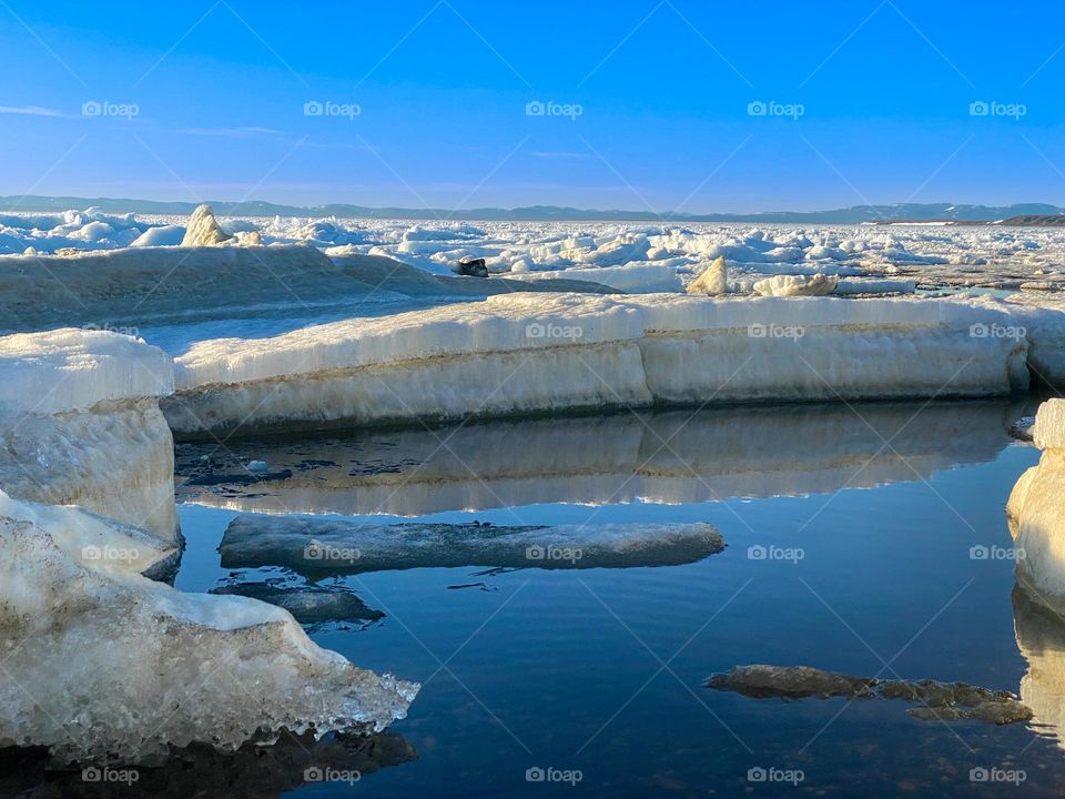 Melting ice floes during the annual break up of the winter ice in the Alaskan arctic at Kotzebue Sound
