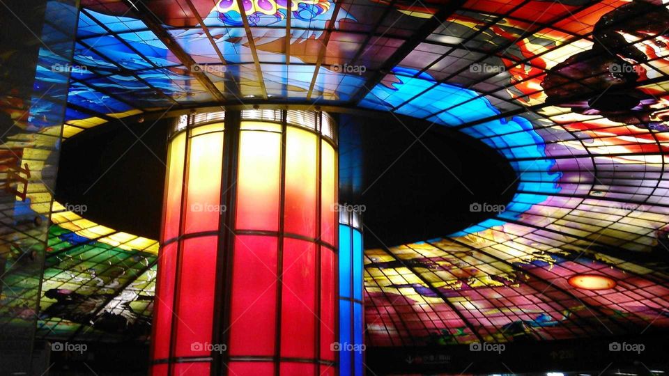 These roof and column of MRT are in Kaohsiung, Taiwan. it is a famous beautiful design in architecture. this is the right part. its light so colorful and gorgeous.