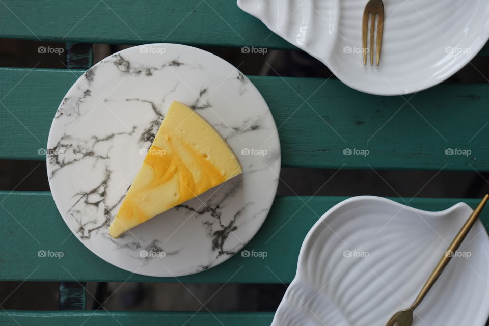 Cheesecake on marble plate 