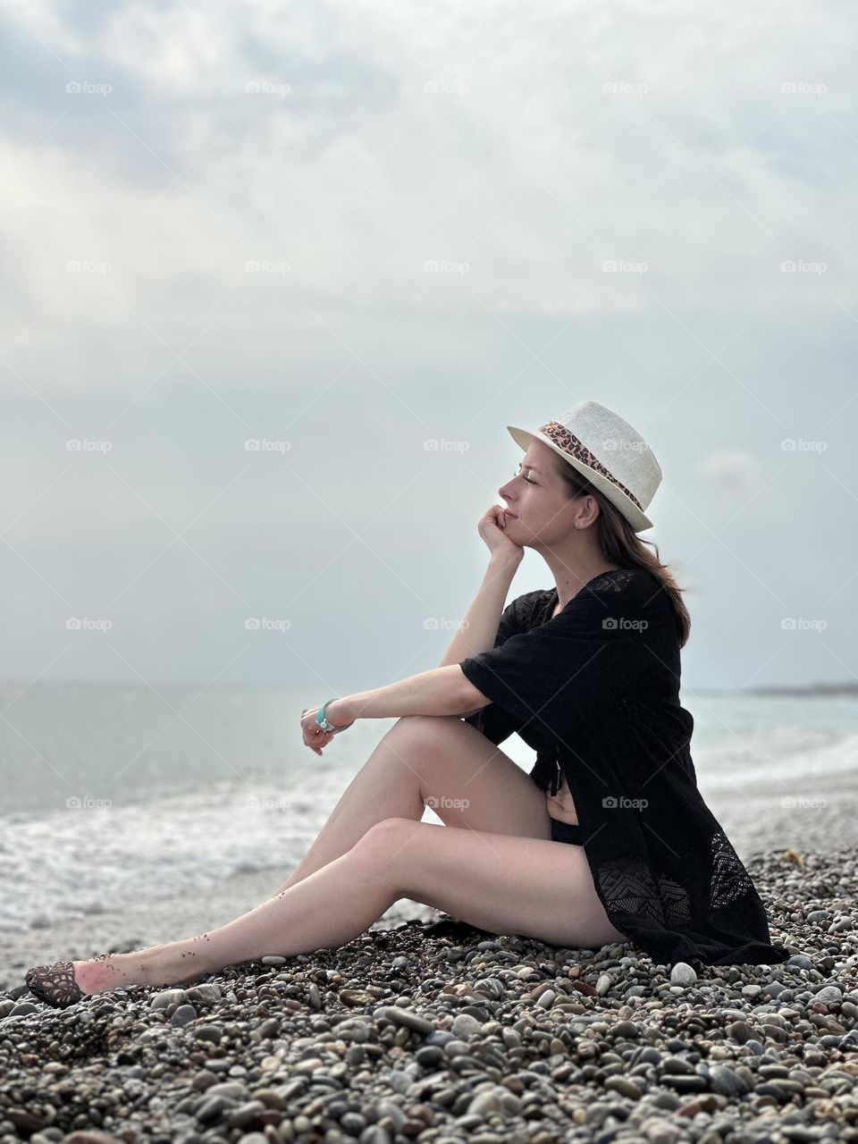 girl resting meditation on the sea bank