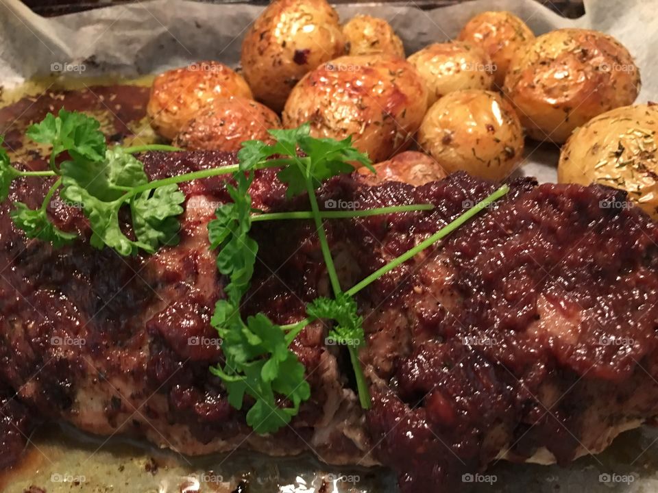 Pork tenderloin with quince sauce baste and roast potatoes, dinner, meal, roast, 