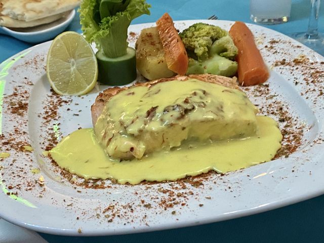 Delicious salmon decorated with vegetables 