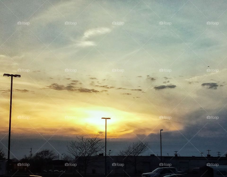 ugly chemical looking sunset over parking lot