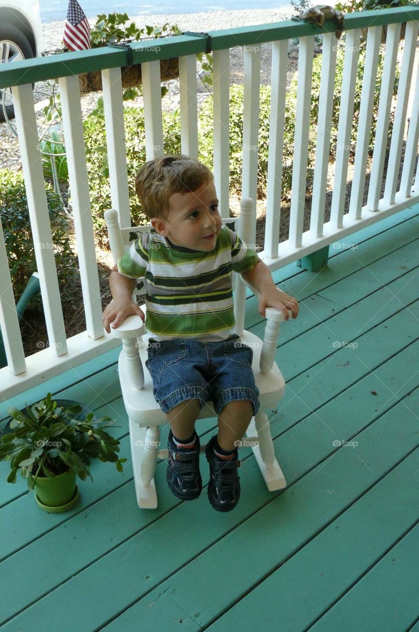 Boy in rocking chair