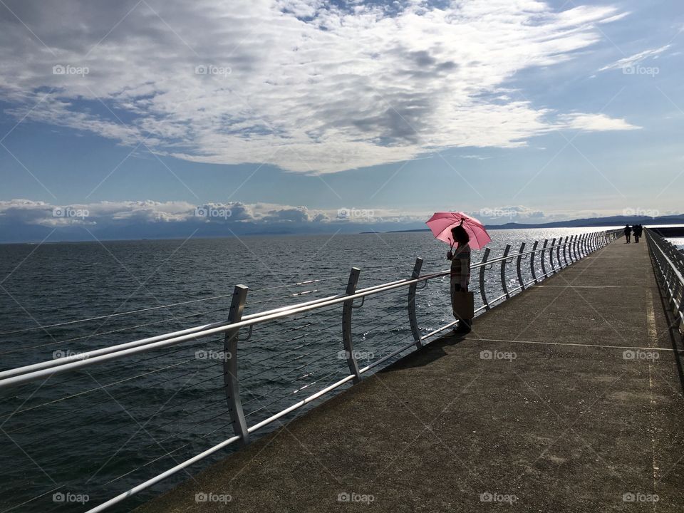 Woman with a pink umbrella