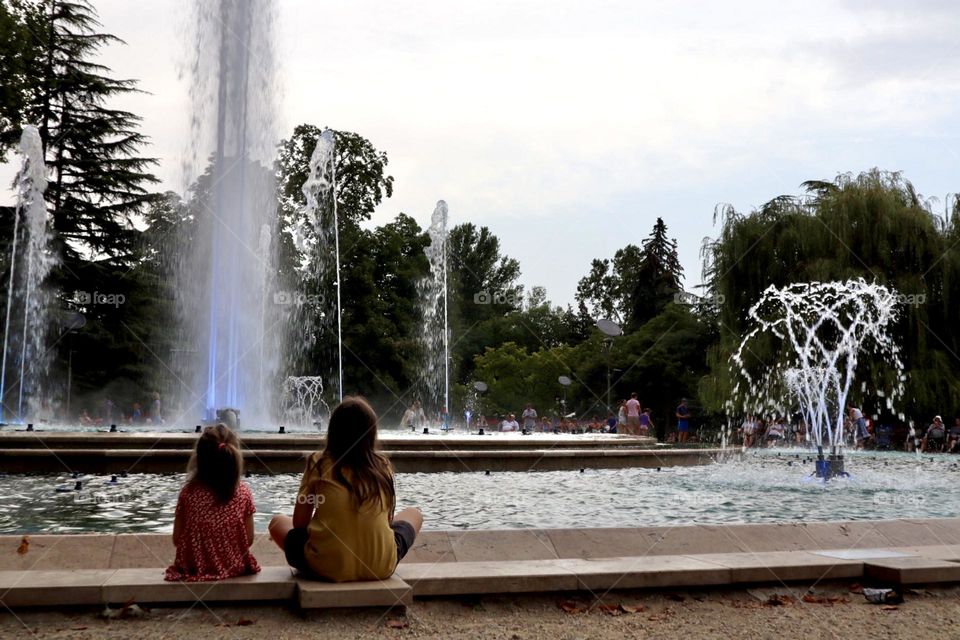 Kids watching fountain water show Budapest 