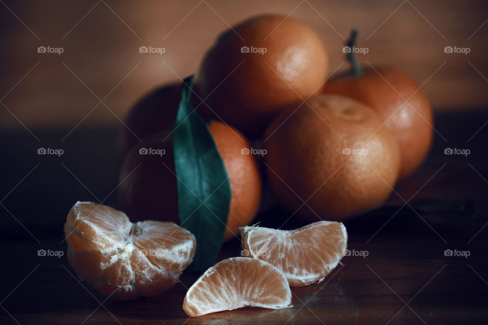 Close up shot of tangerine fruits on table