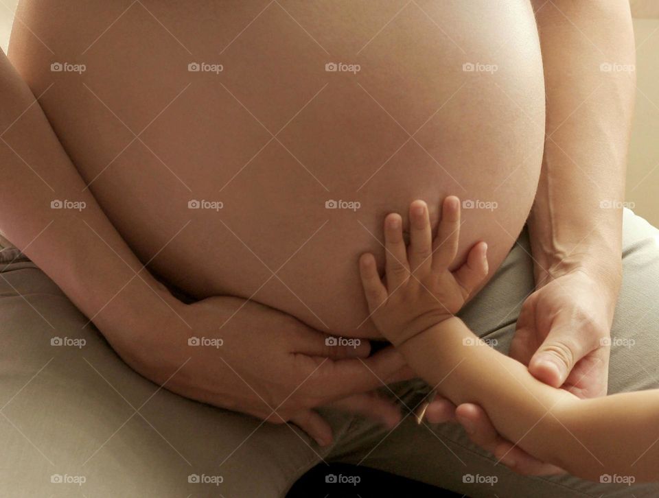 Family time, pregnant woman's belly