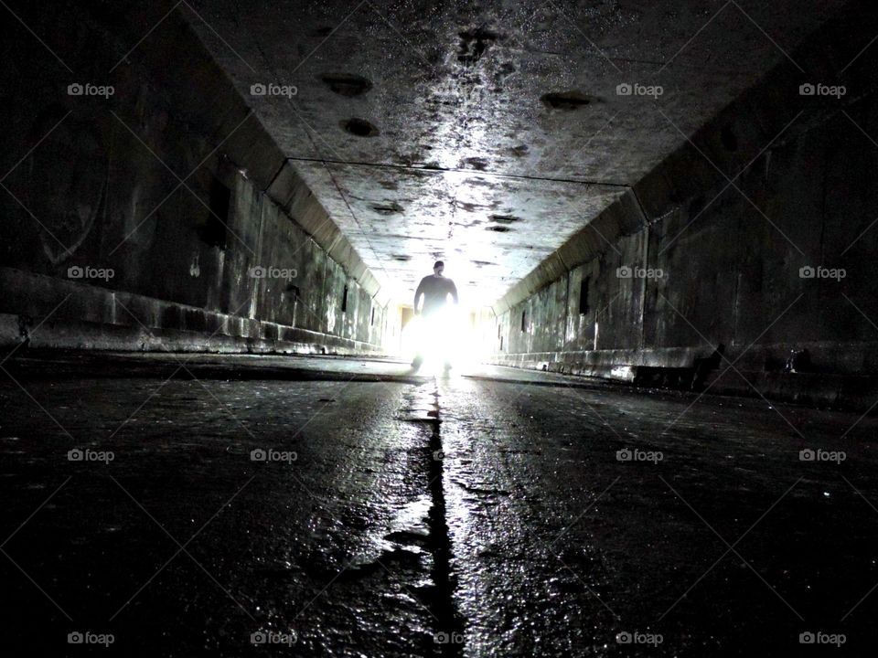 Abandoned Tunnel. Exploring an old highway through the heart of a mountain