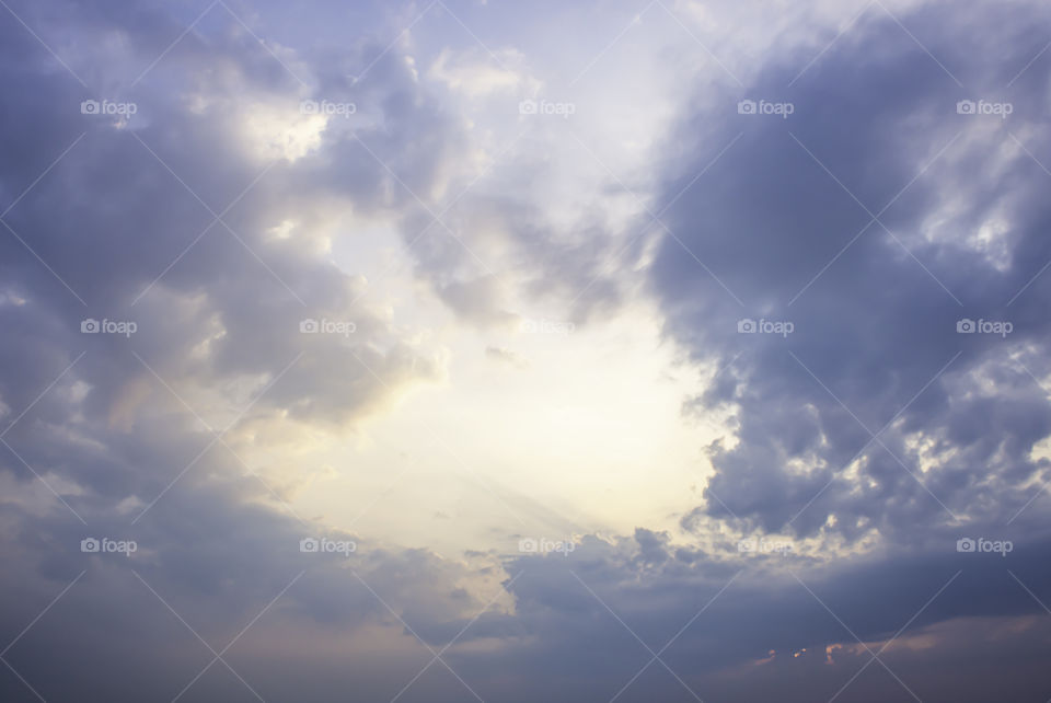 The beauty of the sky with clouds and the sun.