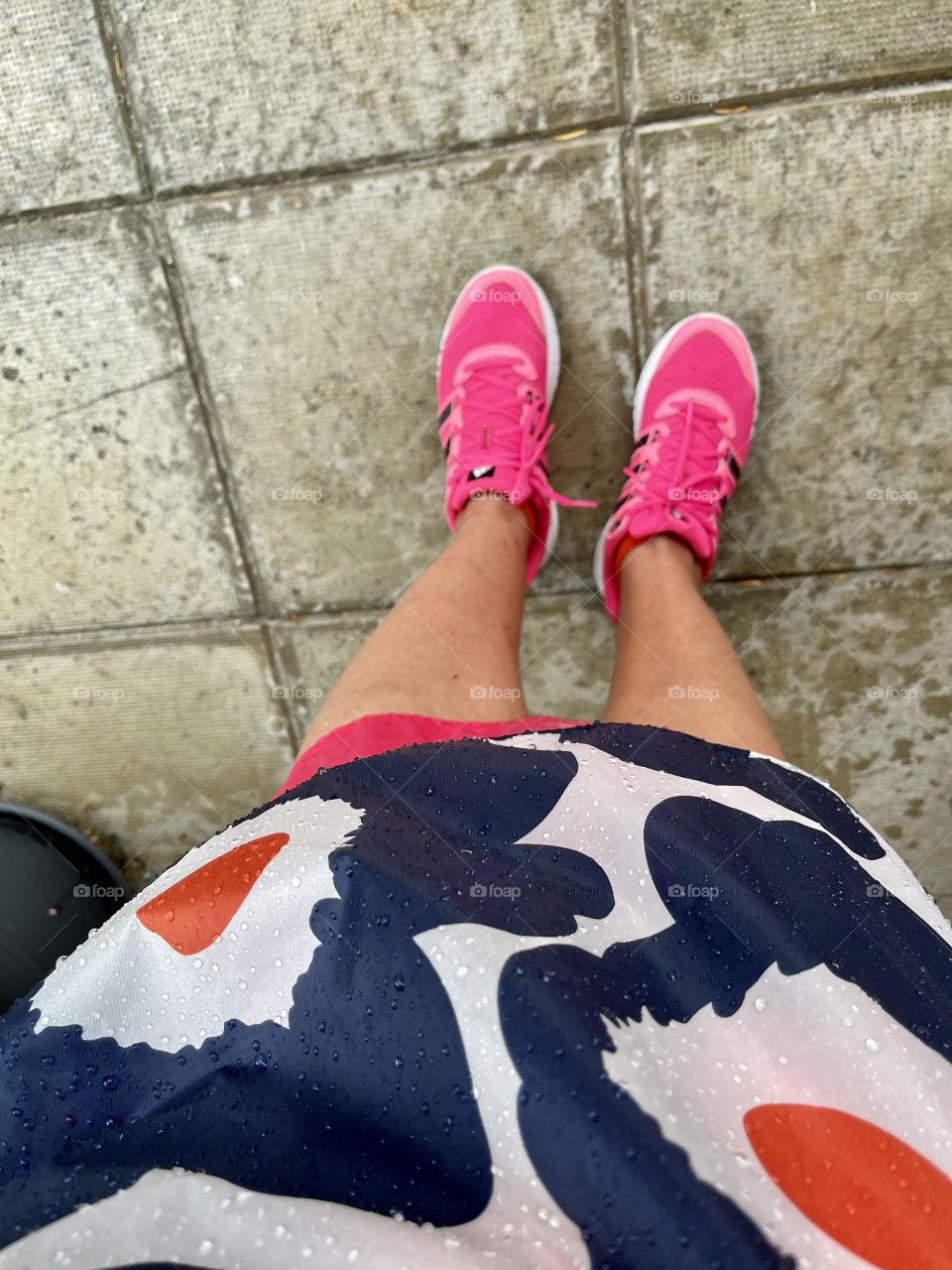 Rest from surprise rain with rain poncho and wet sneakers