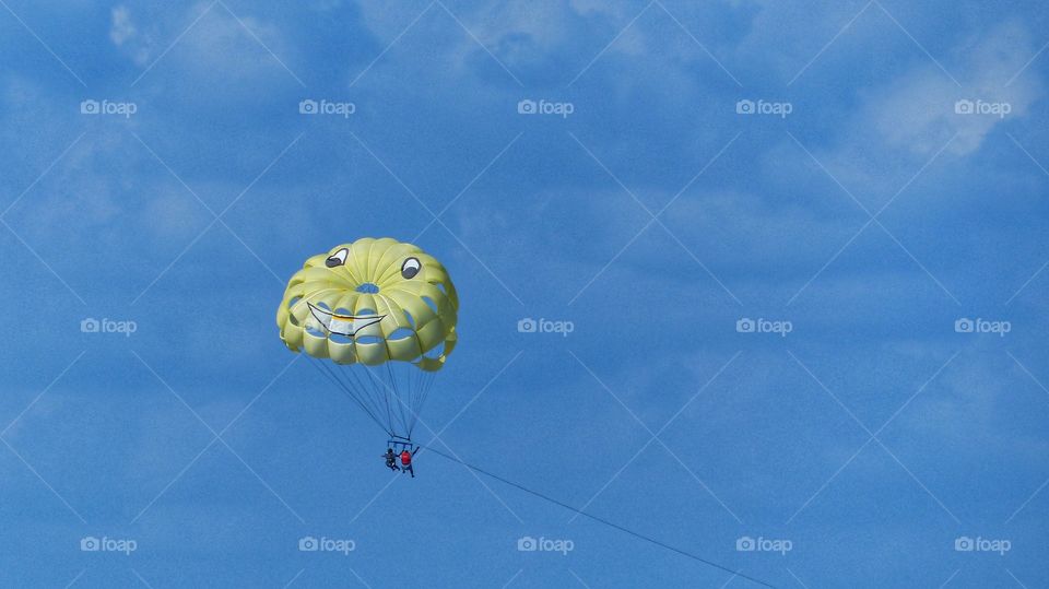 Yellow parasail with smiley face