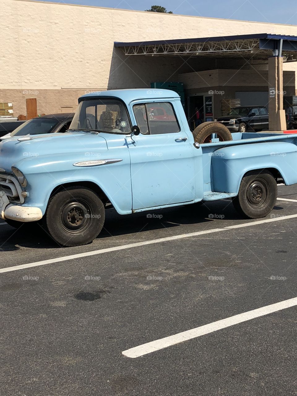 Foapcom A Baby Blue Old Ford Pick Up Truck In A Parking