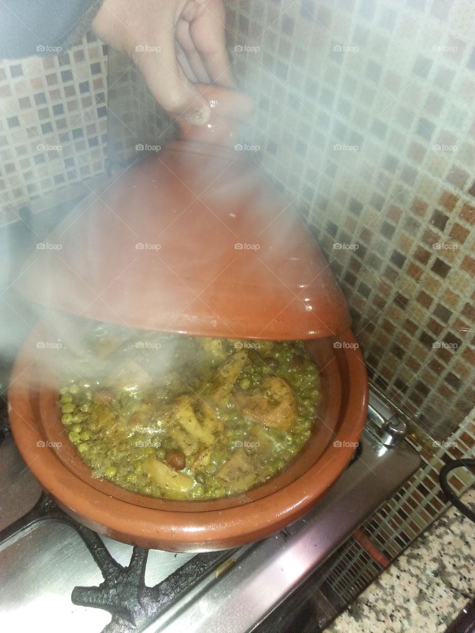 a smoke coming from moroccan Tajine.