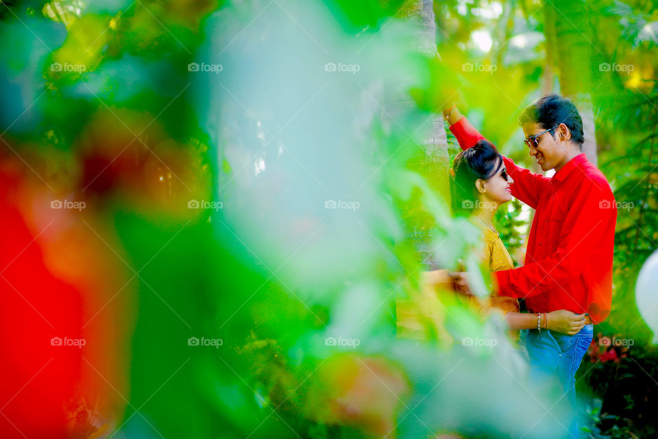 View of Indian couple against tree