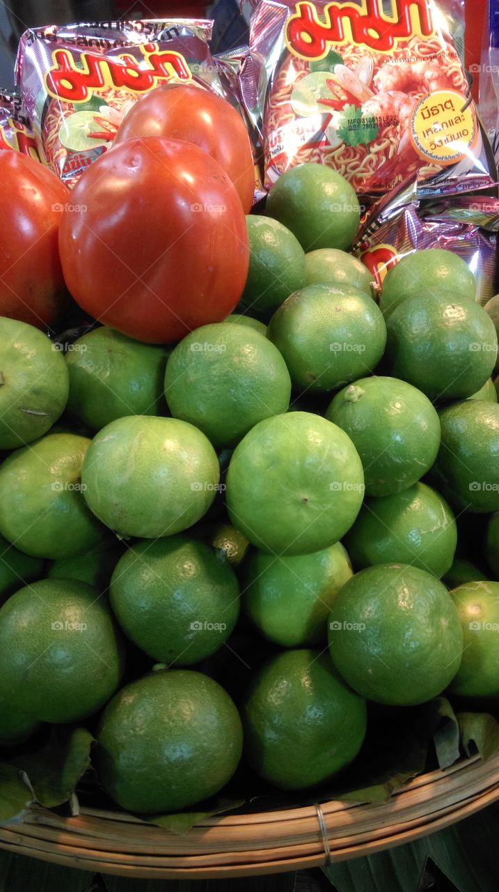 Fresh green lime and tometo.
