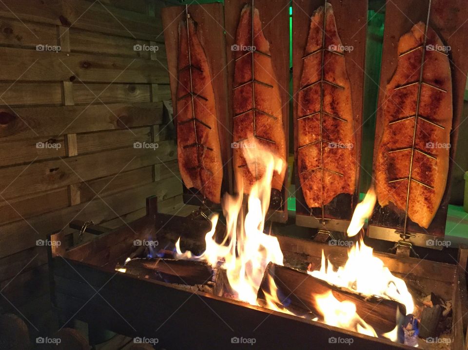 Salmon over a fireplace