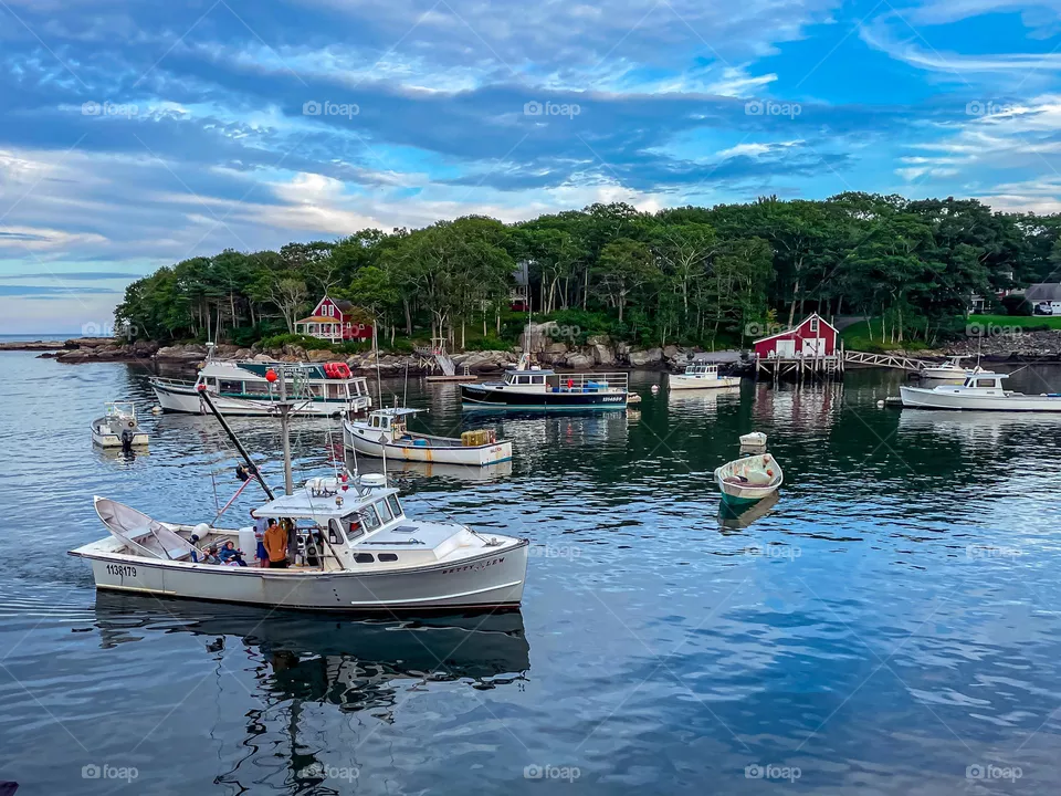 “Home Sweet Harbor”.  A lobster boat returns to harbor at the end of the day.