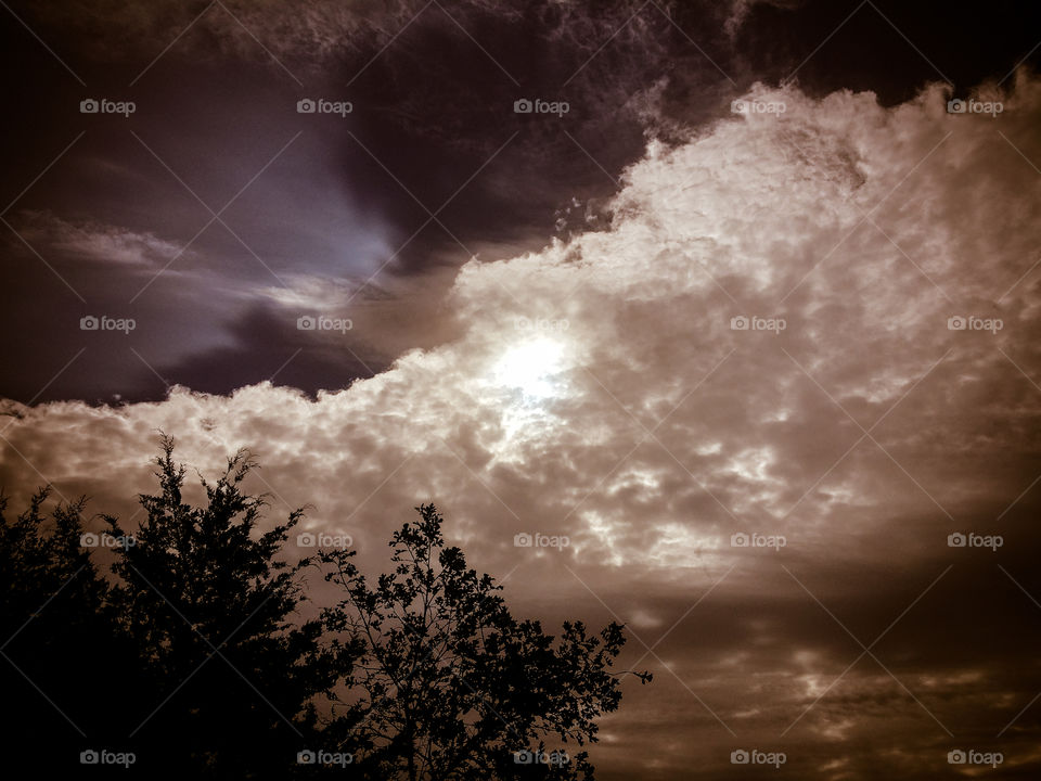 Sun Behind the Storm Cloud