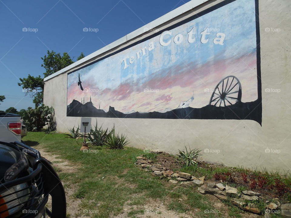 wild west. This is a picture of the old West painted on the side of the building in Bridgeport Texas