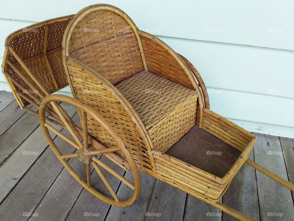 a miniature wicker rickshaw
