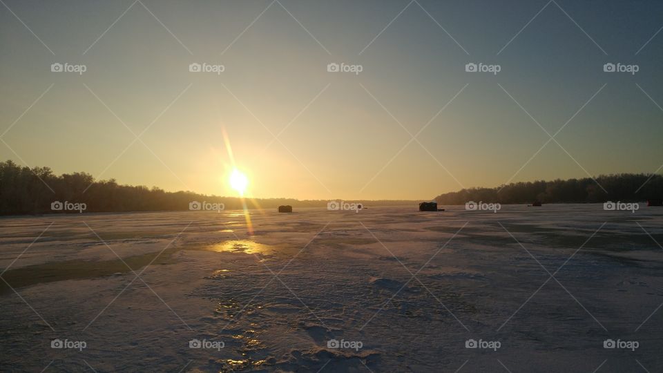 Sun up ice fishing