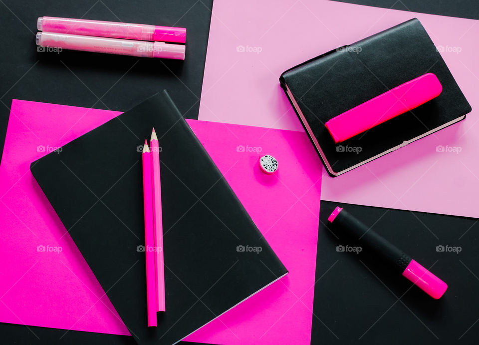 Shocking pink and black stationary flat lay