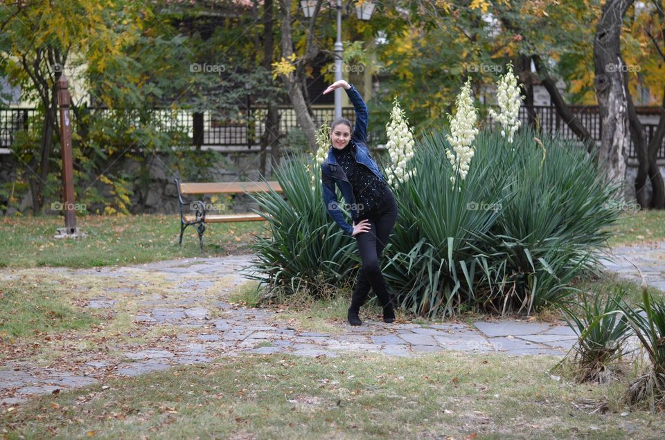 Beautiful Young Girl Dancing Outside in Nature