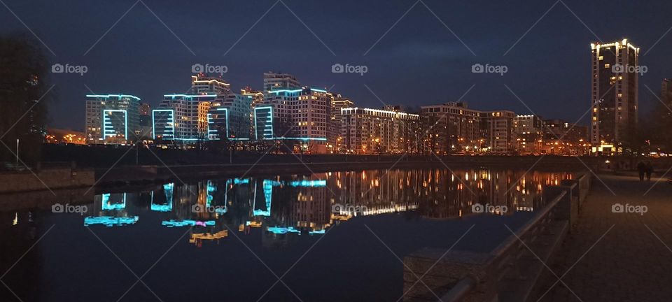 beautiful night light street view, windows magic light, cityscape and reflection in water