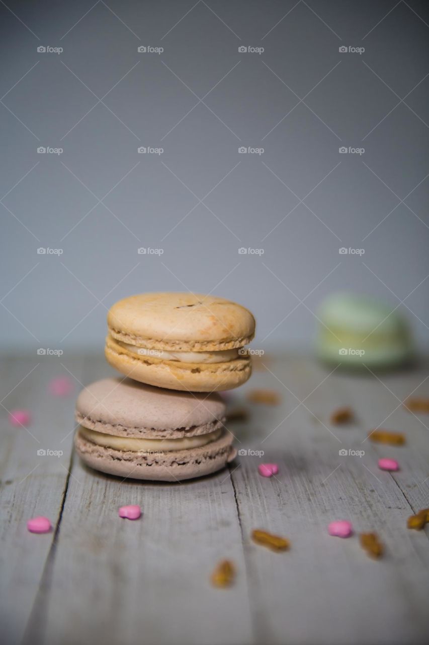 Colorful Macaron Macaroons Food photography design with sprinkles on wood board