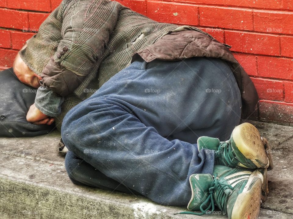Homeless Person Sleeping In An Alley
