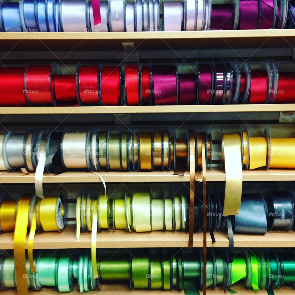 Reels rows of ribbons in shop rainbow