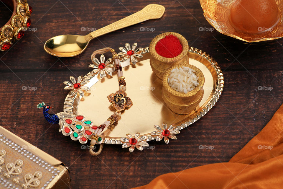 traditional Indian festival raksha Bandhan on red satin