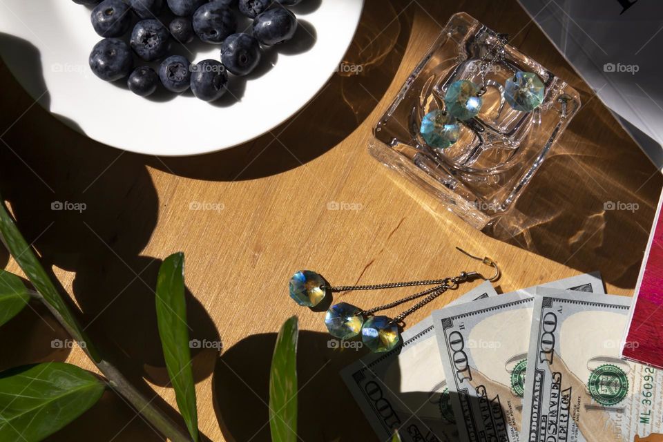 Fresh, appetizing blueberries on a white plate with holiday and summer items.