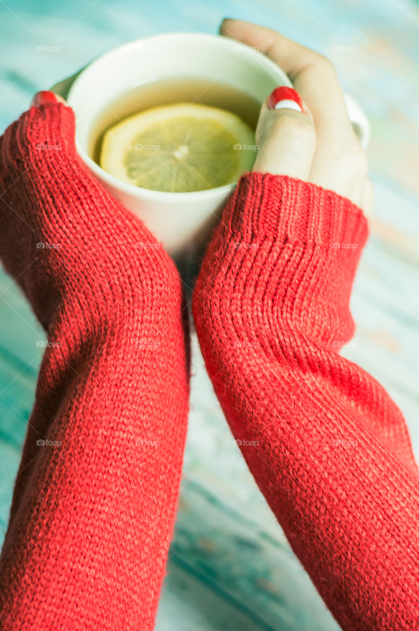 woman hand with cup of tea