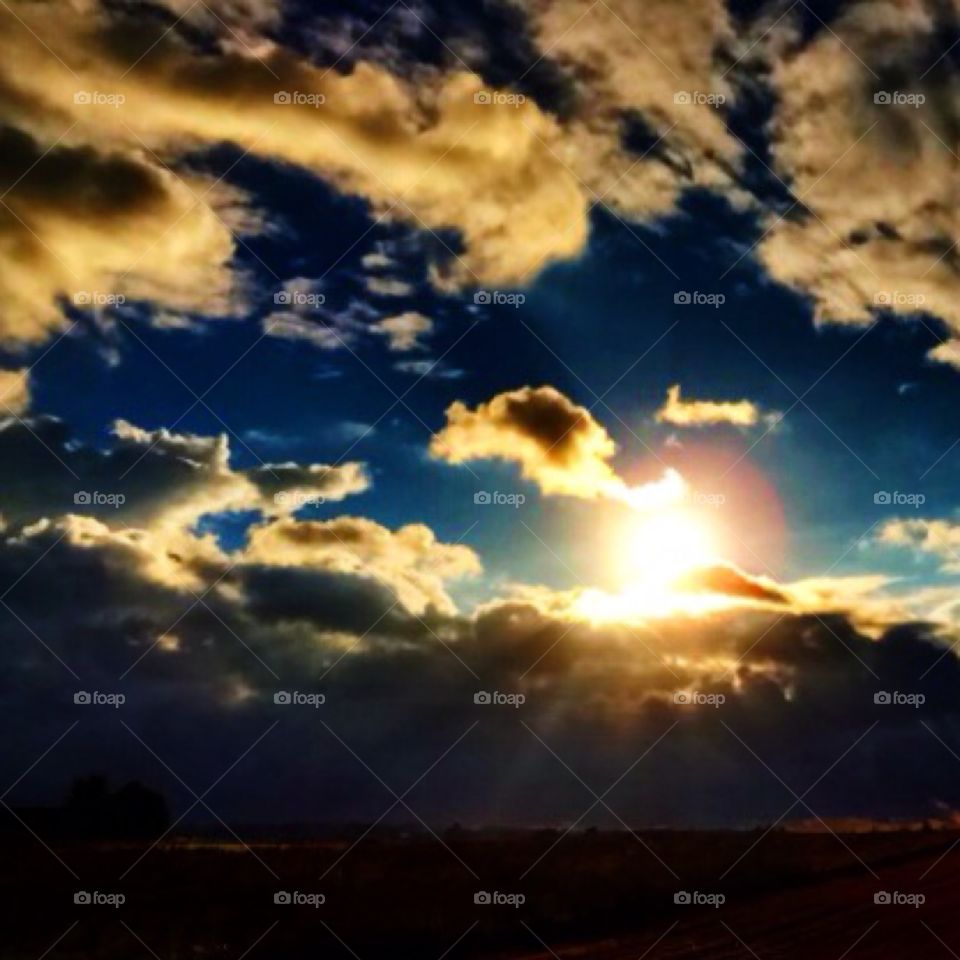 Peaking sun. The sky, Roskilde, Denmark, fall 2014