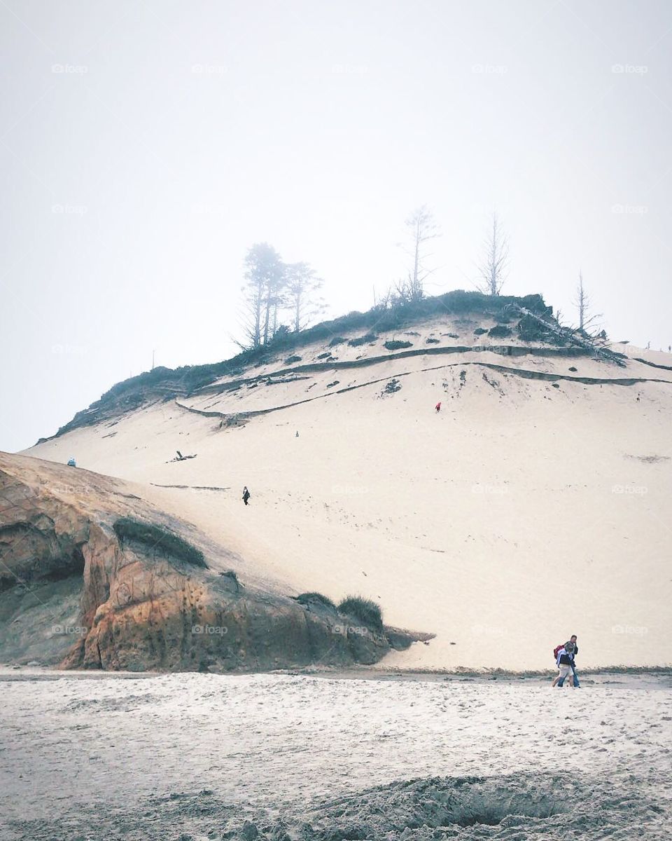Massive sand dune on the side of a beautiful beach in pacific city, OR. 