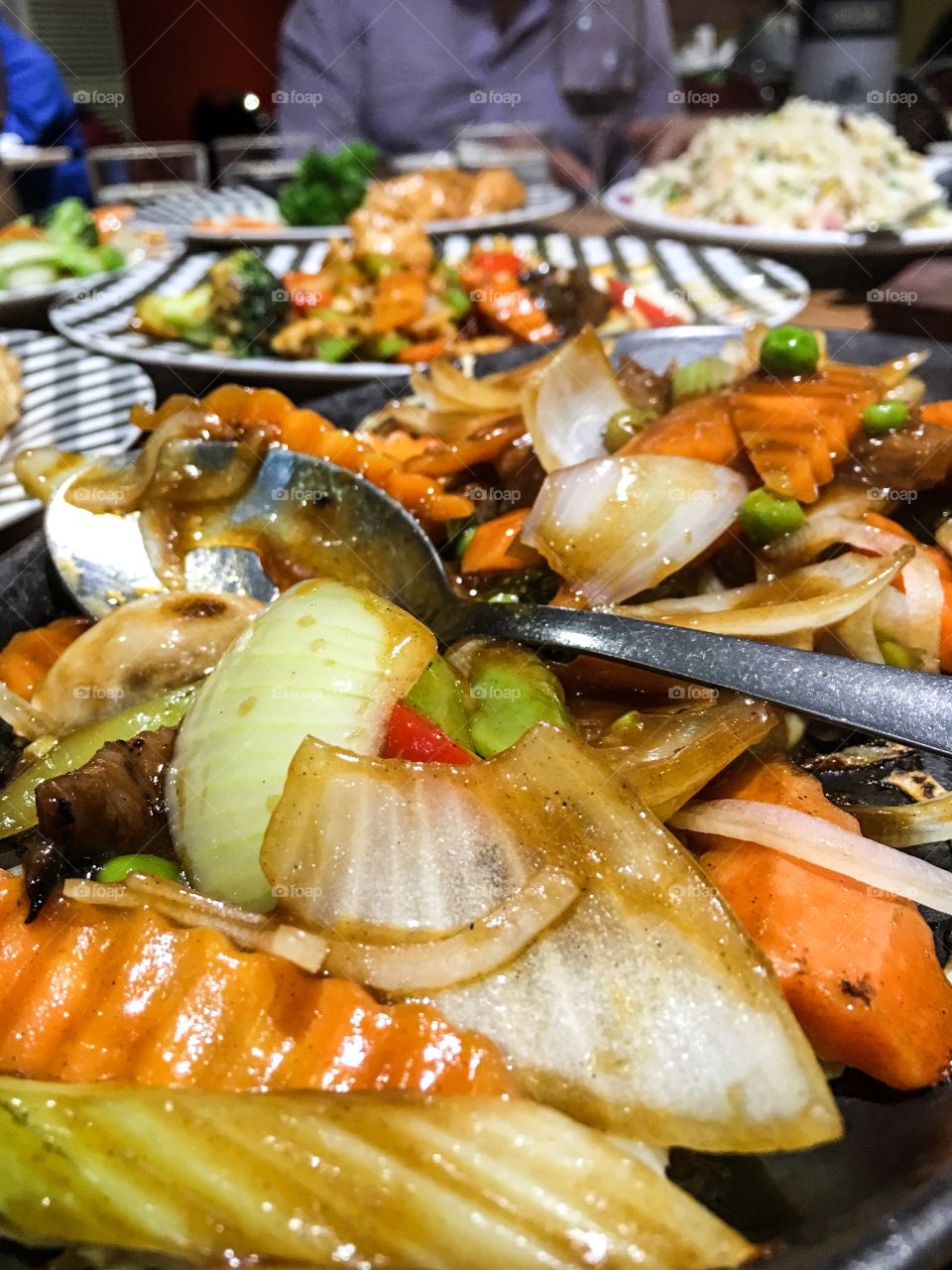 Chinese ethnic food on plates, closeup dishes