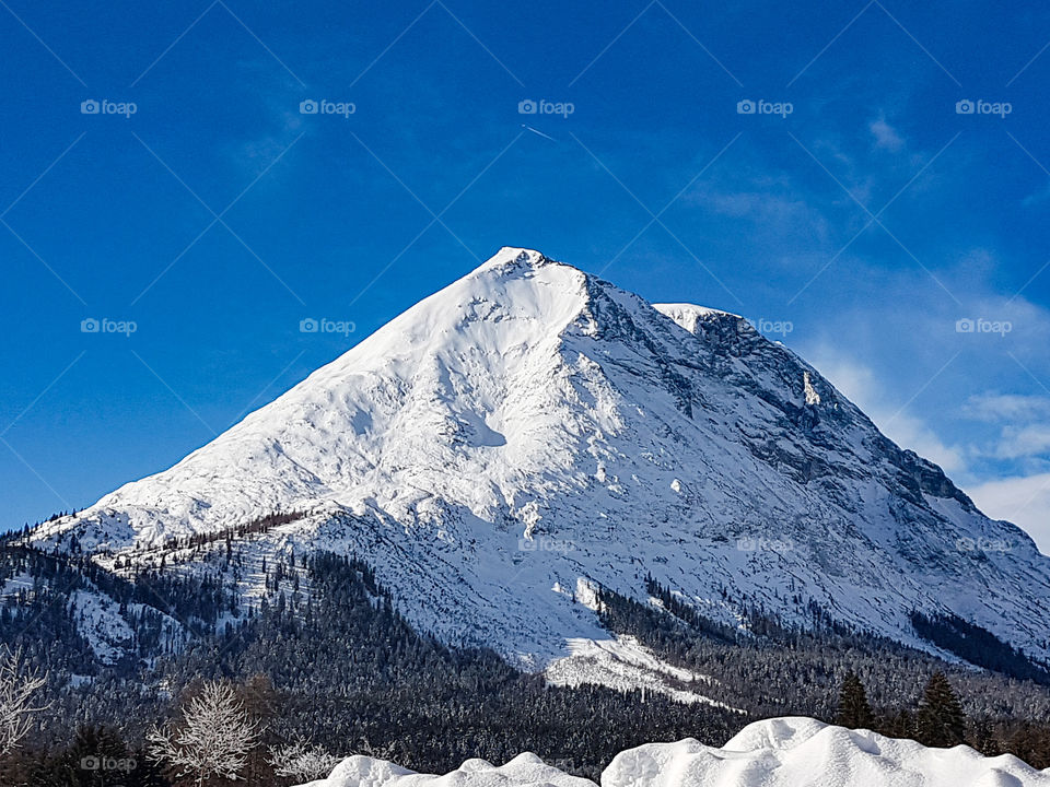 mountain with snow and blue sky in Austria