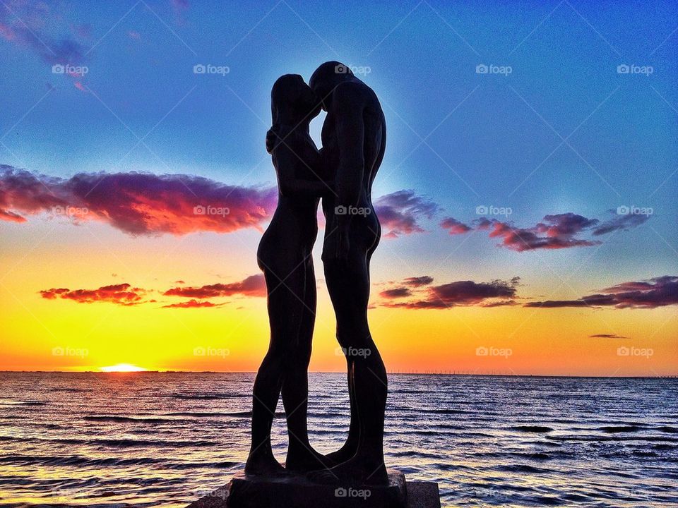 Loving couple in sunset