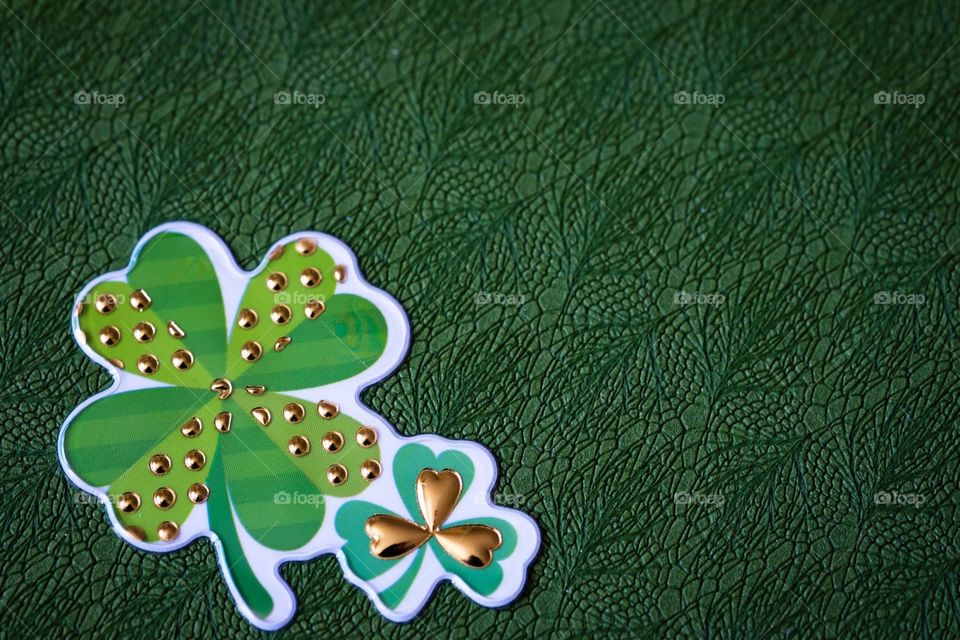 Double Shamrock Design On A Green Background 