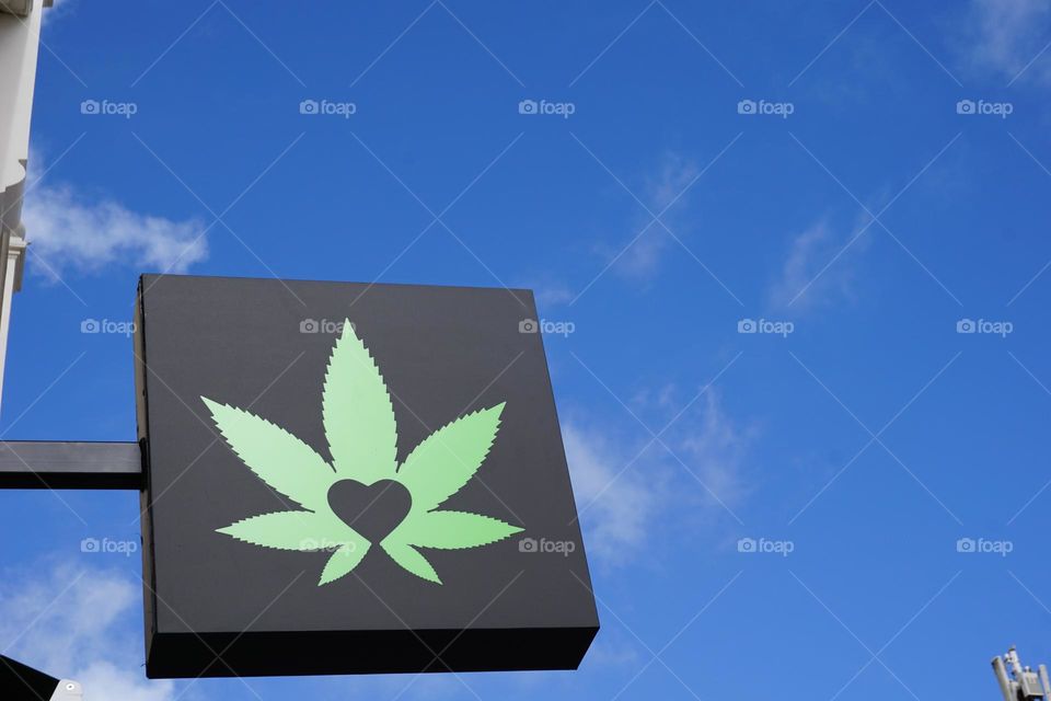 Marijuana sale store ad board.