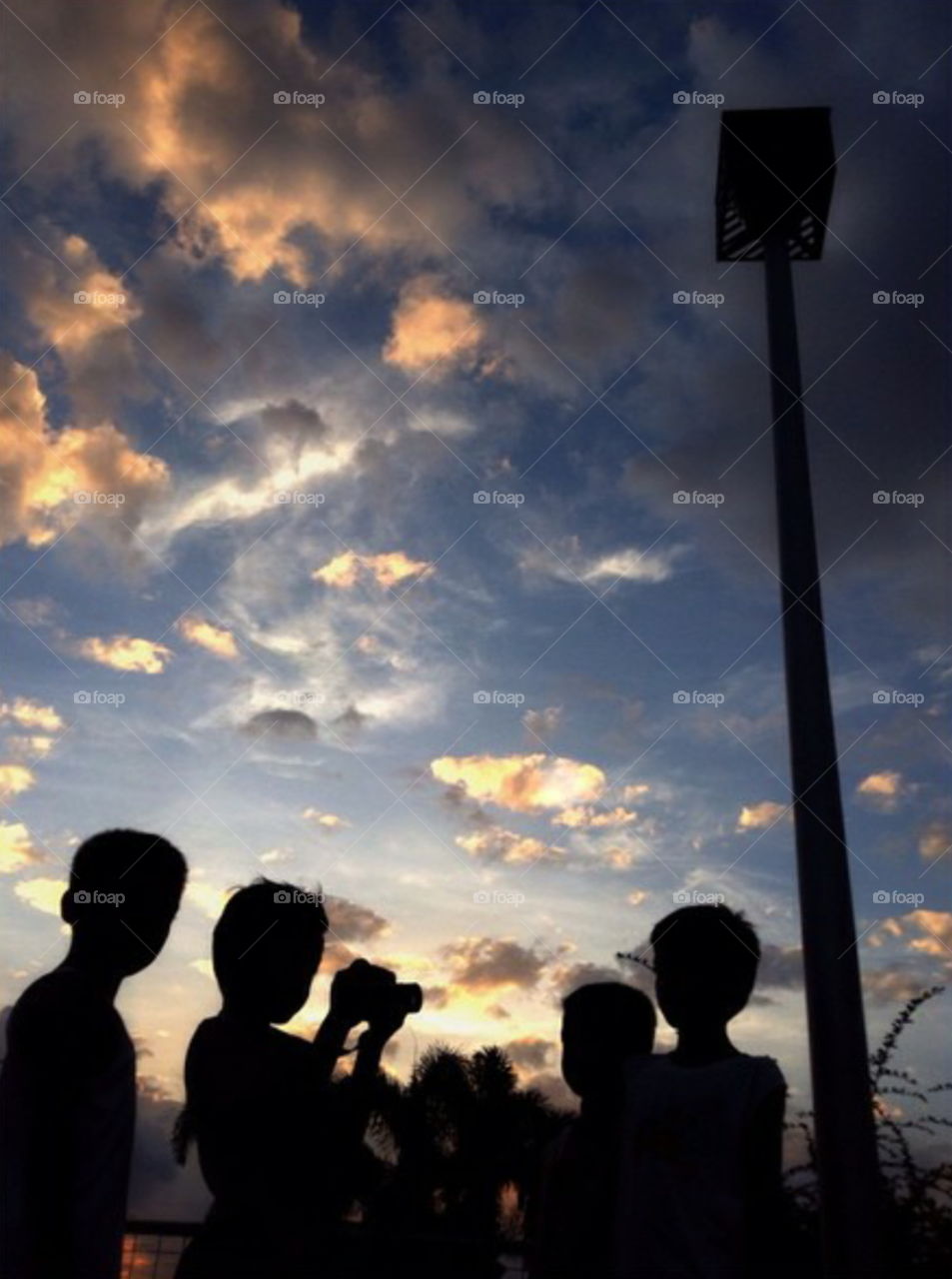 kids playing under the sky