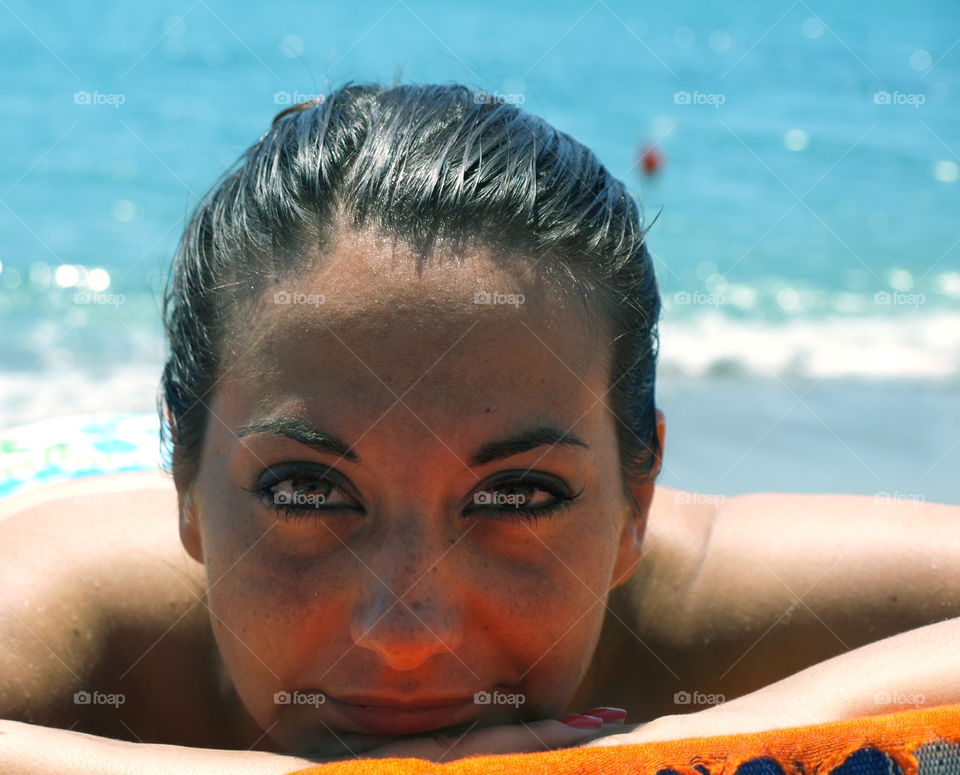 portrait of relaxed woman at the sea