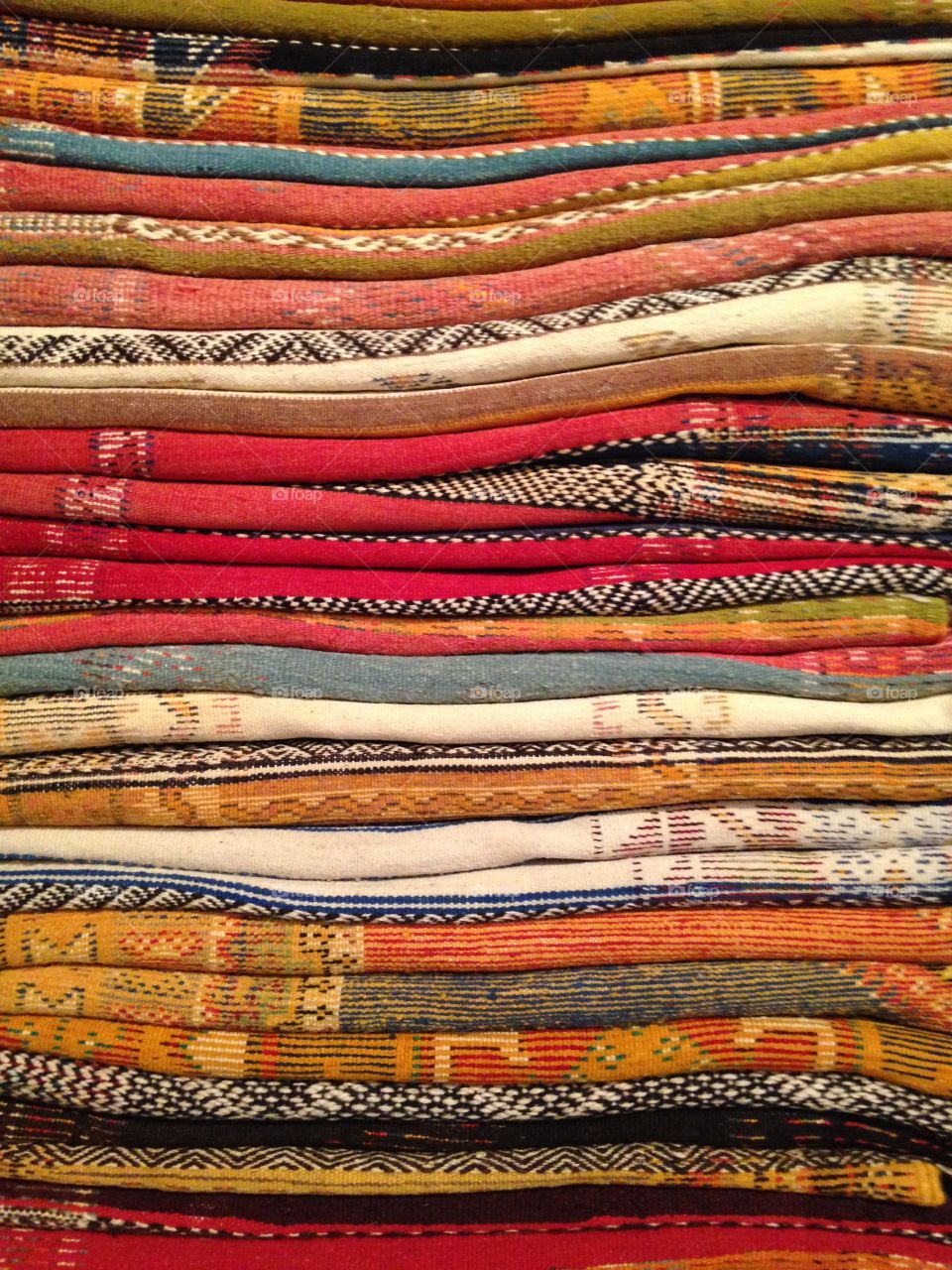 Pile of Antique Rugs in Marrakesh Market